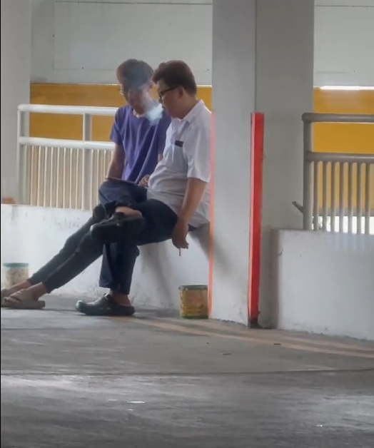 “Smokers in Sync: Bromance Sparks at Aljunied Carpark”