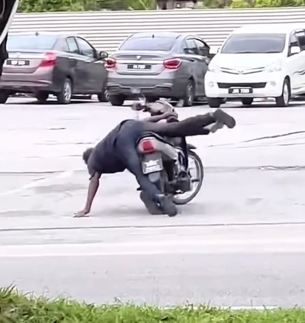 2 Guys Falling on Motorbike